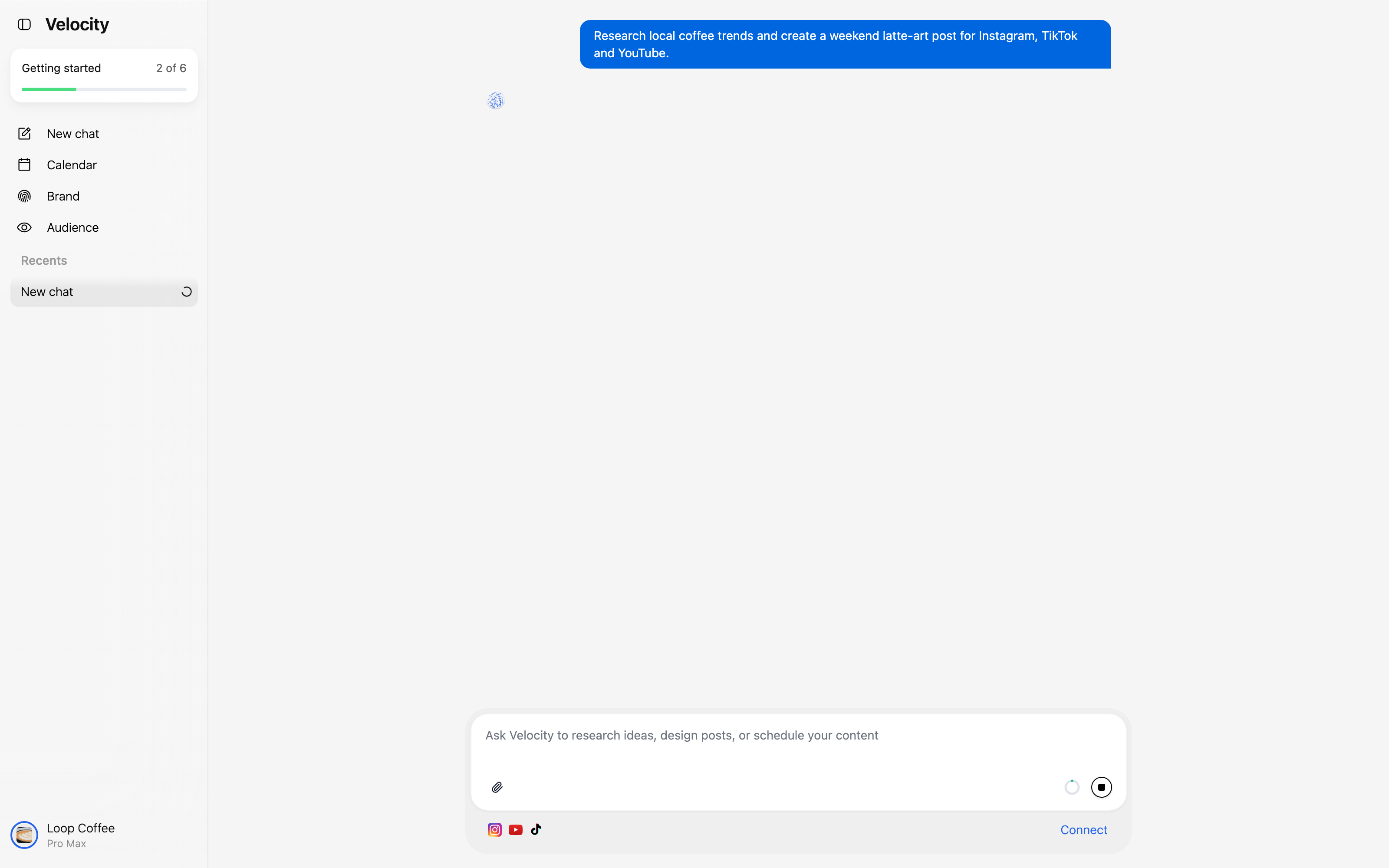 Velocity chat showing a plain-language request to research local coffee trends and create a weekend latte-art post for Instagram, TikTok, and YouTube.