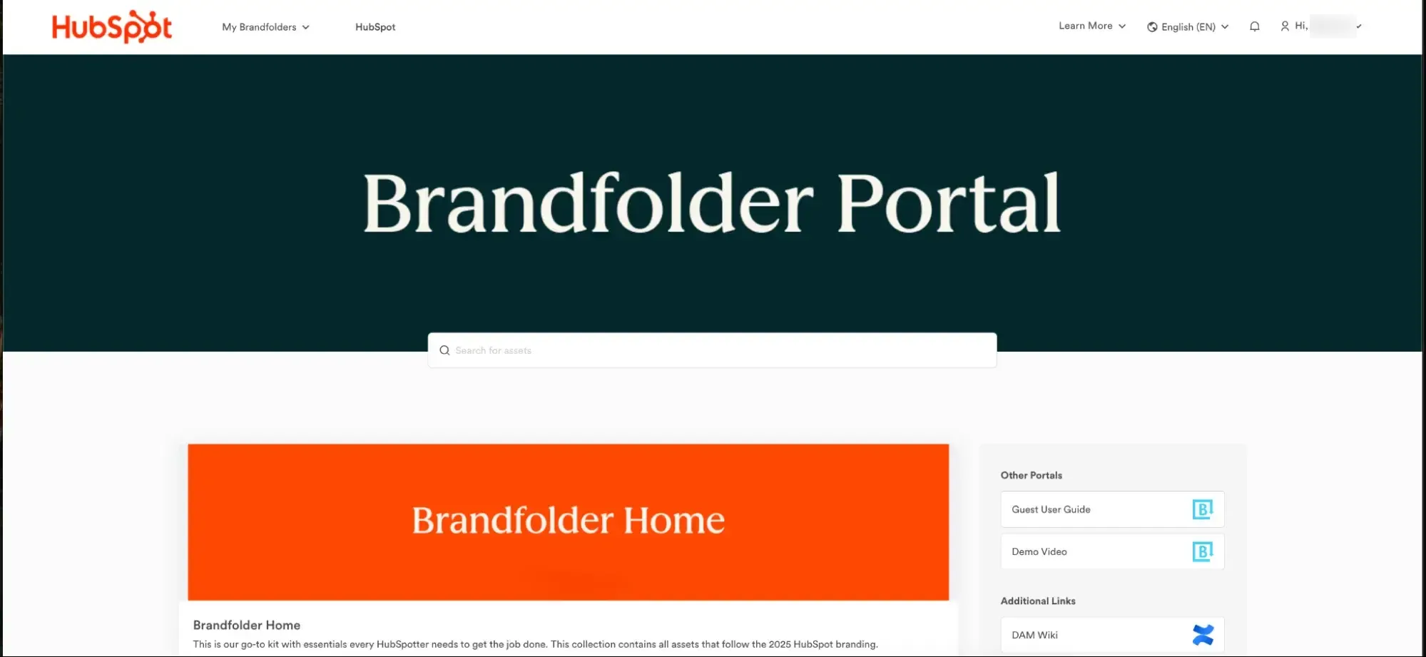 Brandfolder portal showing an asset search bar, a Brandfolder Home collection, and links to a user guide and DAM wiki.